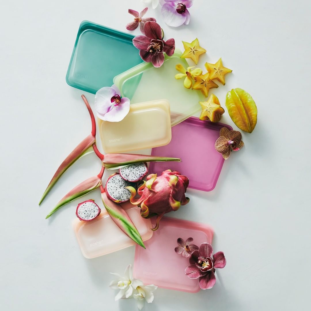 Various Stashers Bags surrounded by fruits